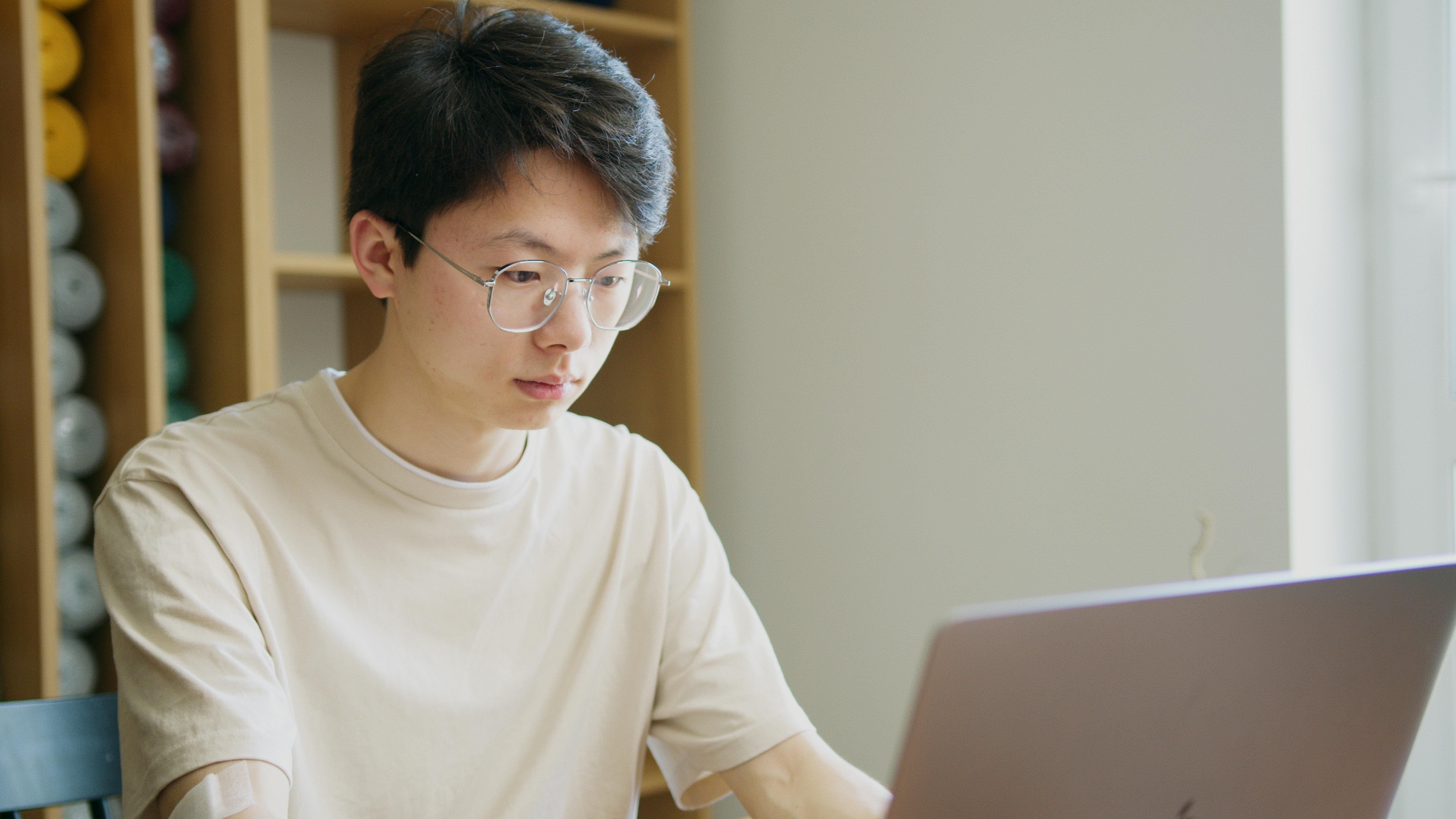 Student studying on a laptop